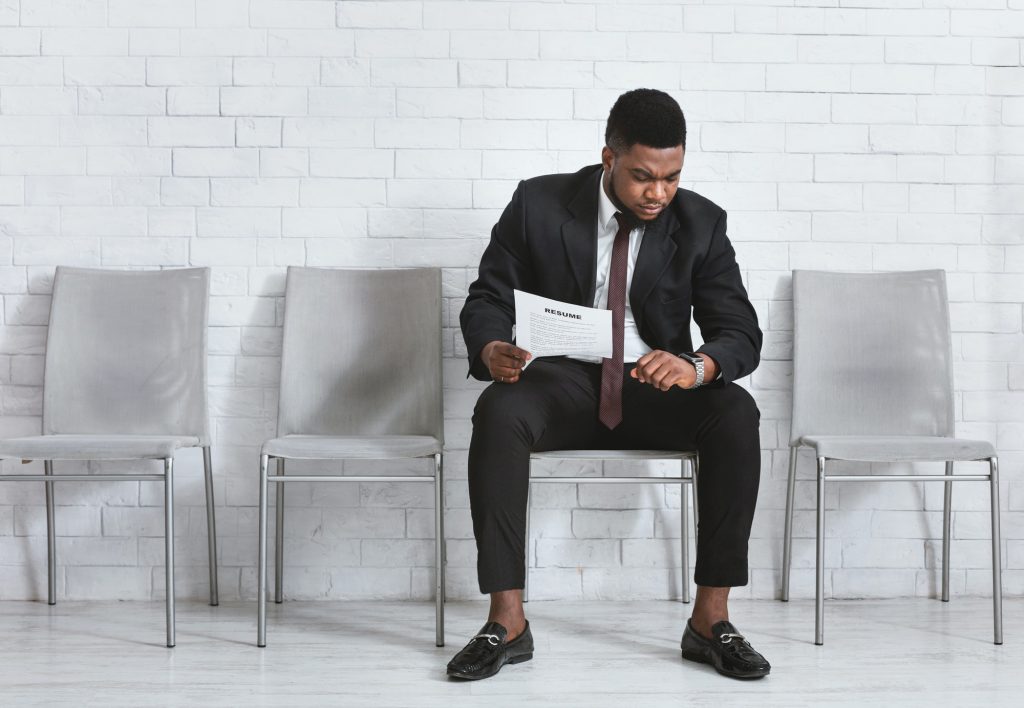 job seeker using the best resume fonts on his job tool waiting for work interview