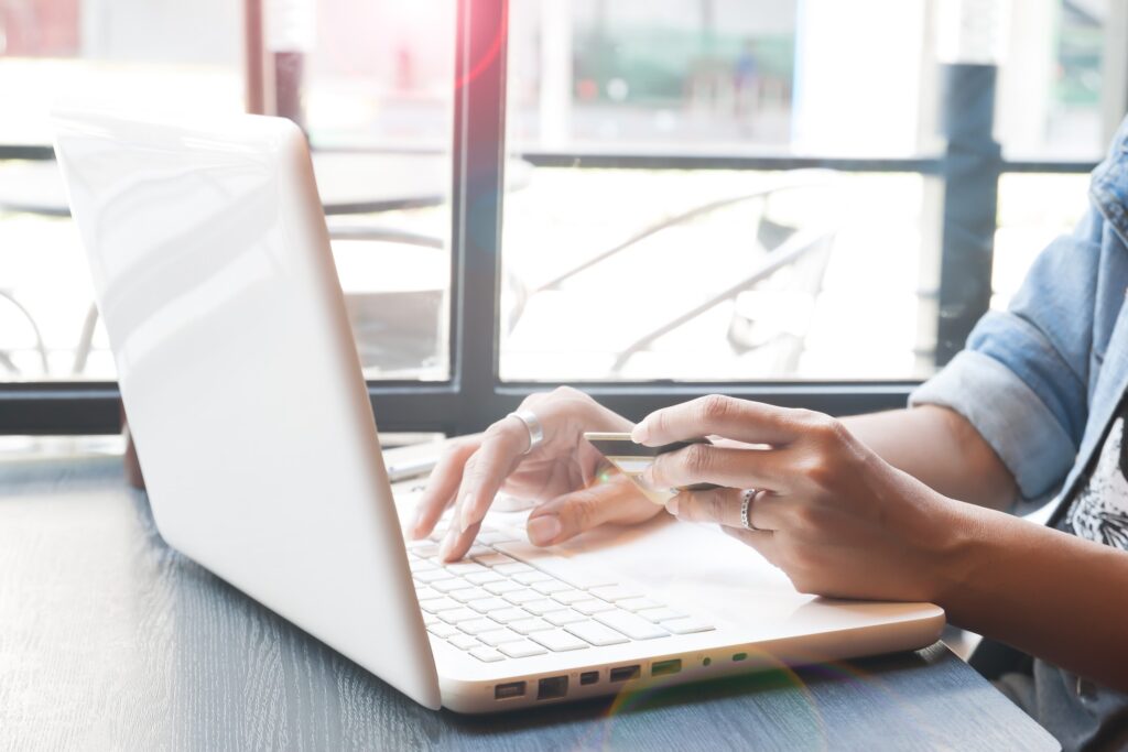 job seeker preparing an executive resume on their laptop