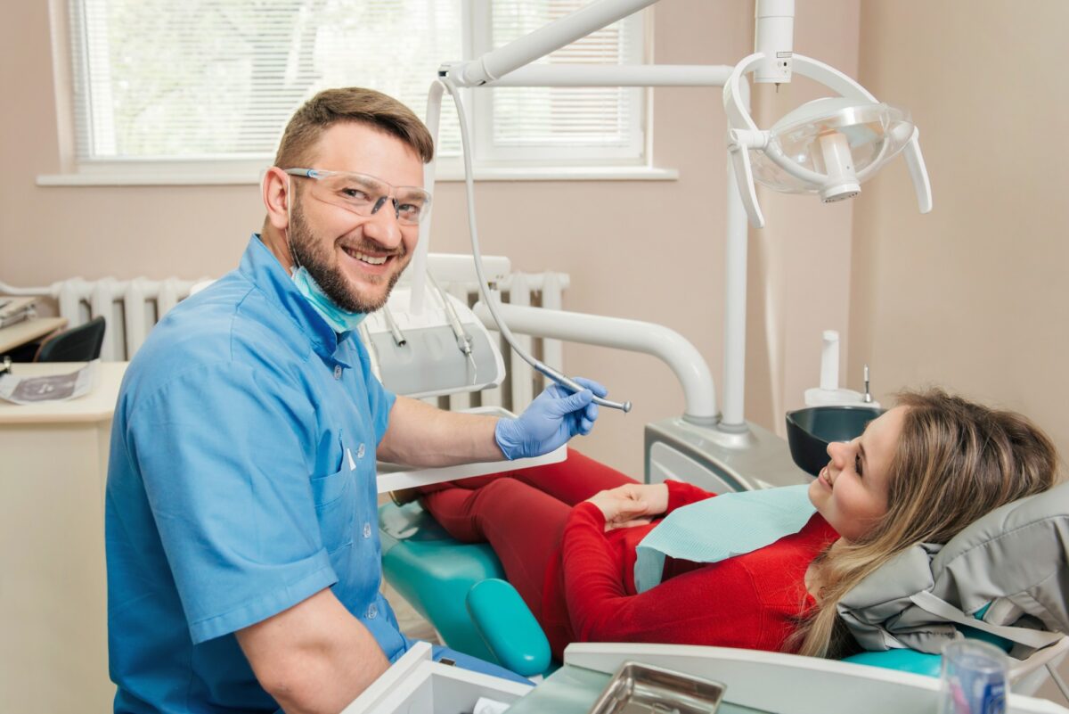 Dentist checking up client