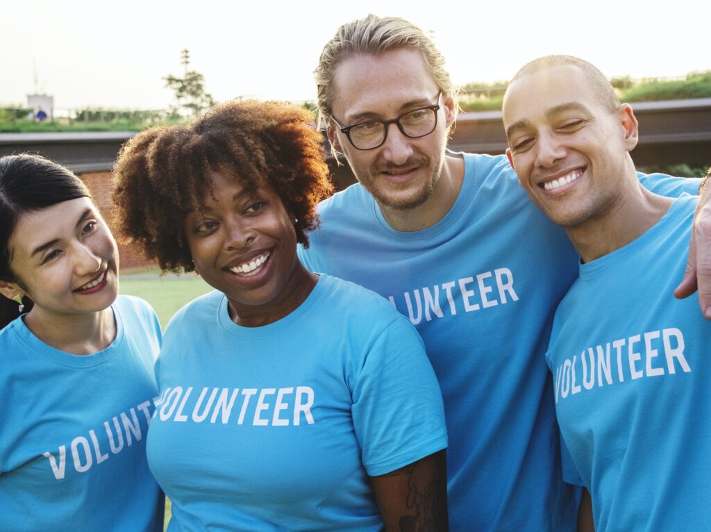 Group of happy and diverse volunteers