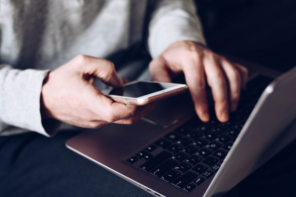 Writing chief of police resume on laptop