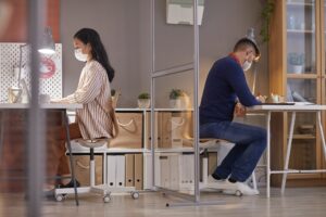 Two Office Workers in Cubicles